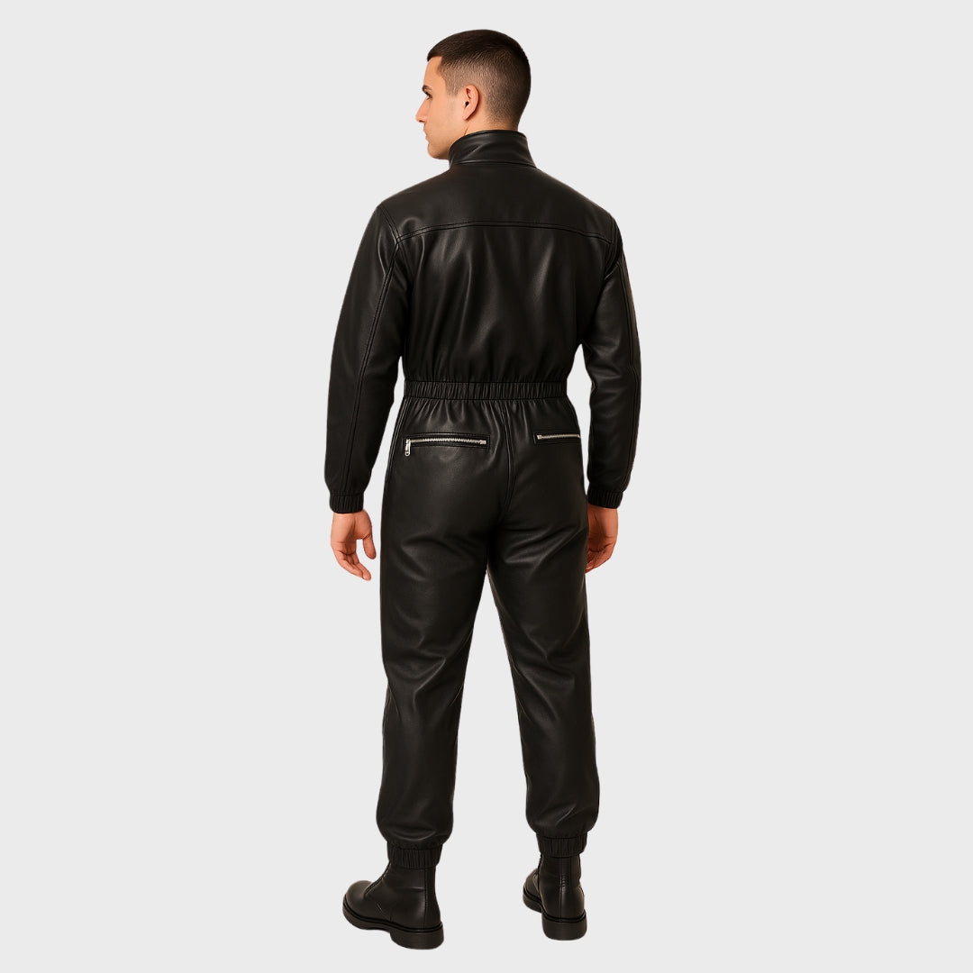 6'4 model wearing a black leather jumpsuit with zipper back pockets and black boots