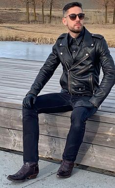 men wearing sunglasses and leather biker jacket with blue jeans and boots