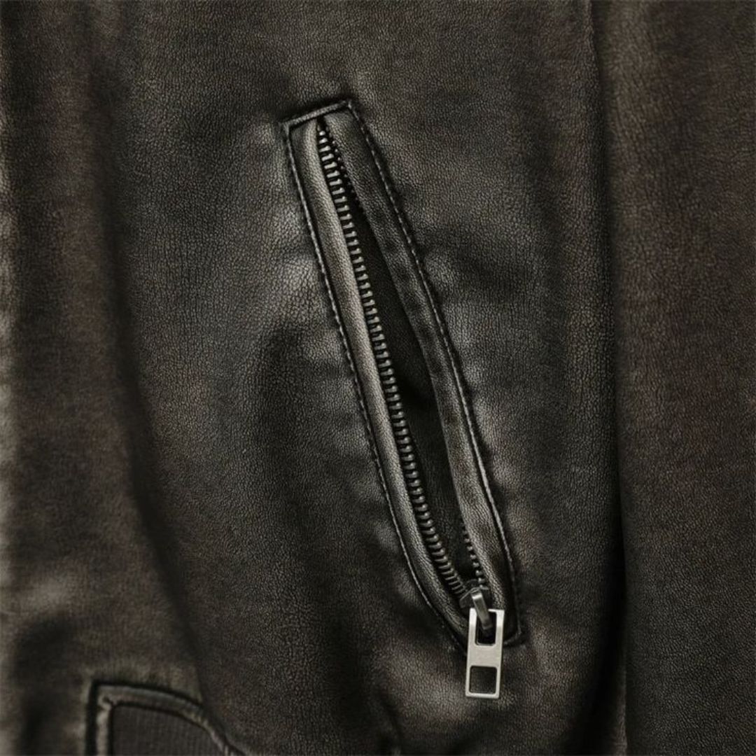 Zipper pocket on a black leather bomber jacket handcrafted with 100% lambskin