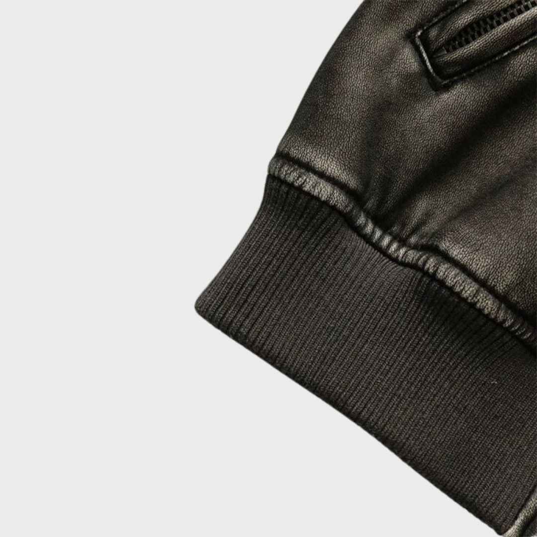 Ribbed cuffs on a black leather bomber jacket