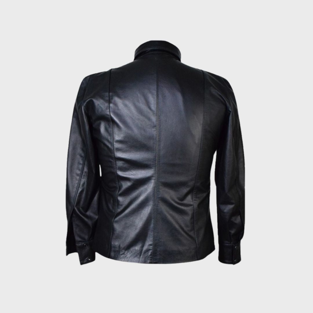 Black leather trucker jacket with shirt collar and welt pockets with flaps.