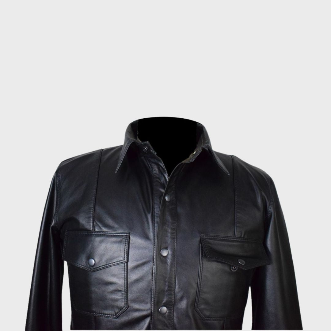 Classic black leather trucker jacket for men with button closure sleeves.